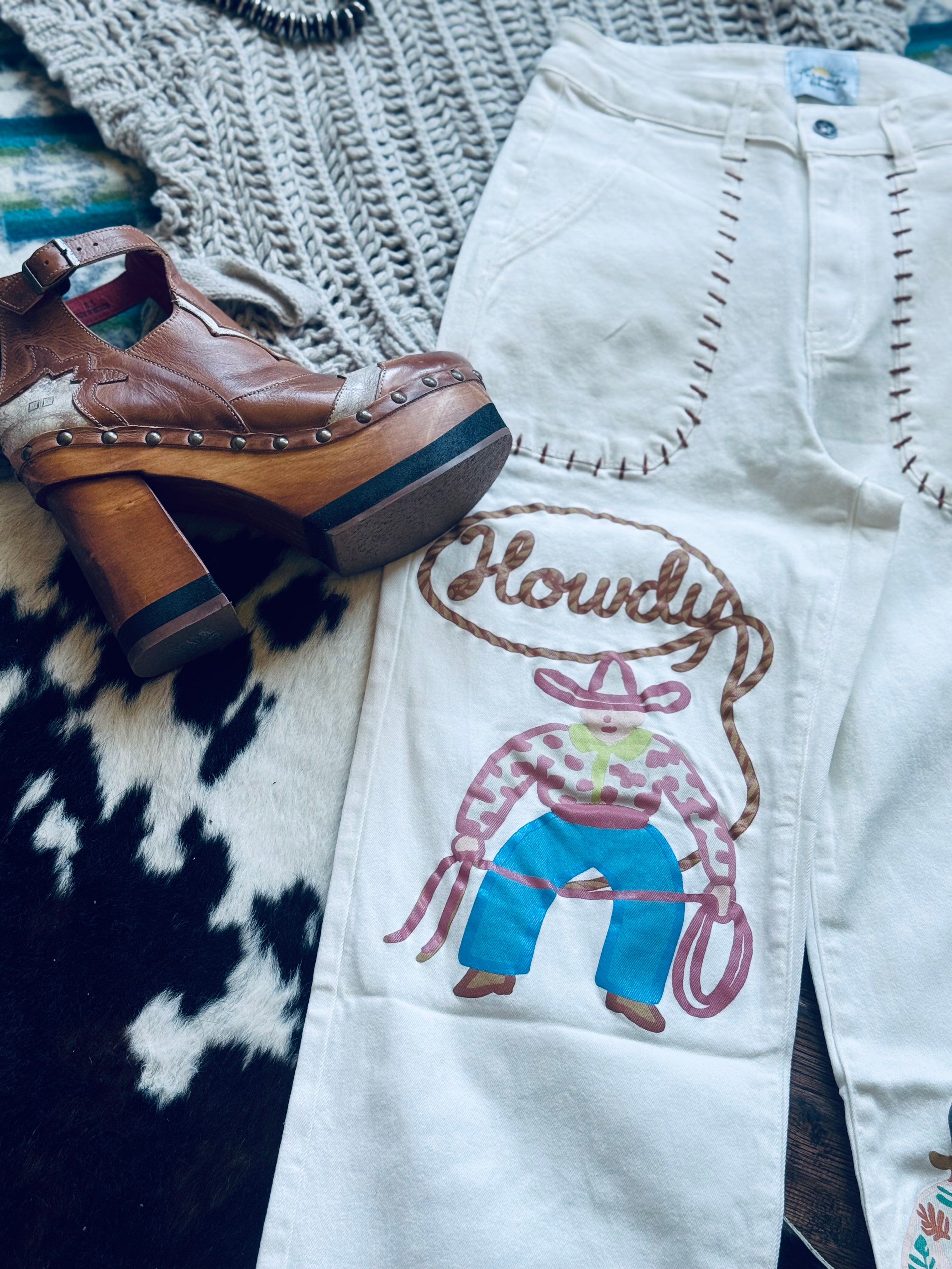 Turquoise have white howdy jeans 