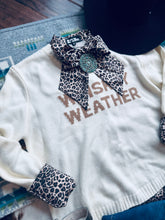 Load image into Gallery viewer, White sweater with leopard print accents and &#39;Whiskey Weather&#39; text on a textured surface.
