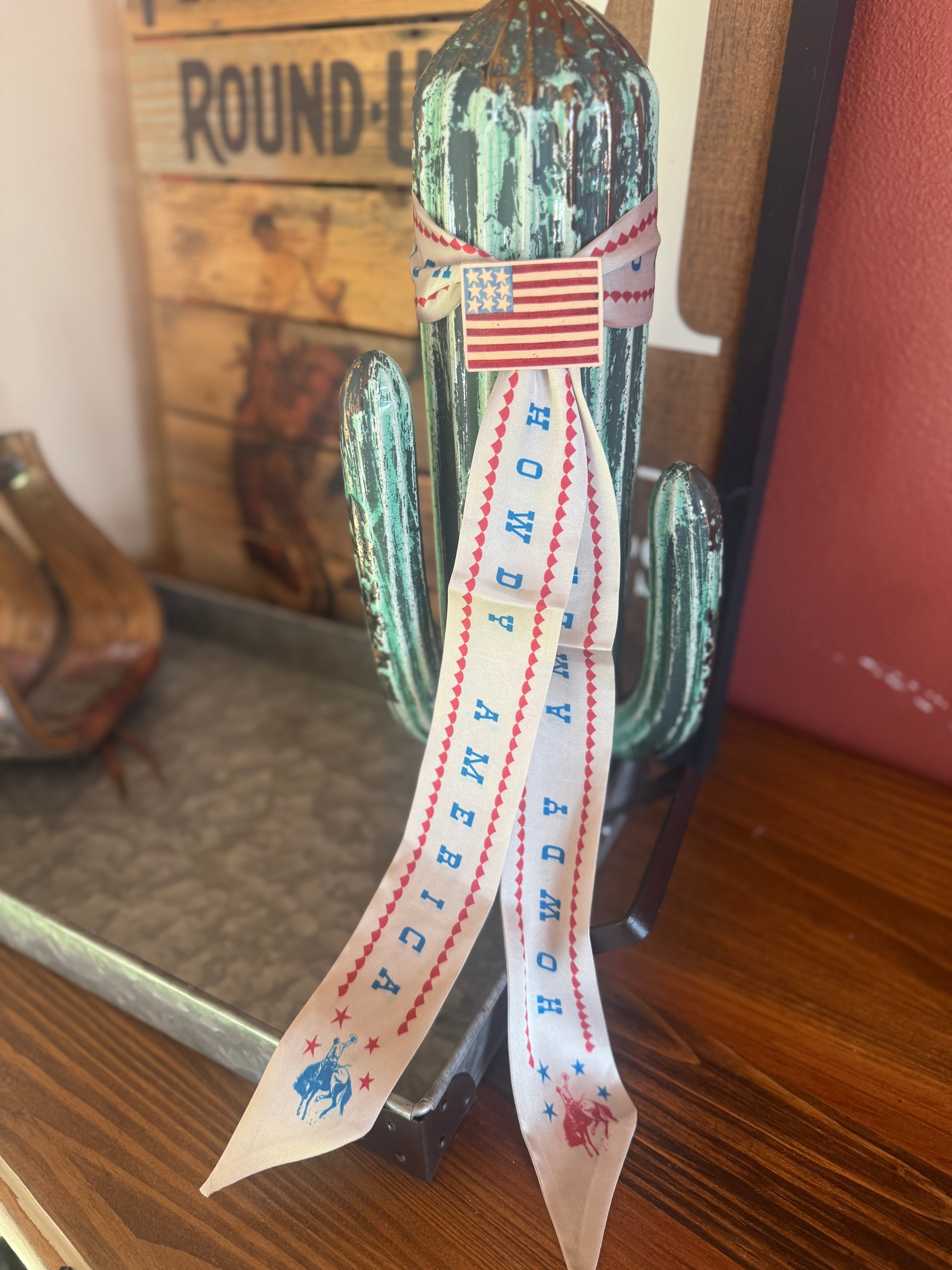 Howdy America and leather pin